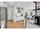 Modern kitchen featuring stainless steel appliances, granite countertops, and wood flooring, combining style and functionality at 240 Hillsborough Dr., Conway, SC 29526