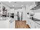 Well-lit kitchen featuring granite countertops, stainless steel appliances, and white cabinetry, offering ample space at 240 Hillsborough Dr., Conway, SC 29526