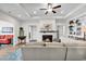 Cozy living room with a fireplace, built-in shelving, a ceiling fan, and comfortable furnishings at 240 Hillsborough Dr., Conway, SC 29526