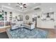 Spacious living room with neutral tones, stylish rug, and access to kitchen at 240 Hillsborough Dr., Conway, SC 29526