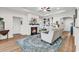 Bright living room with fireplace, built-ins, and stylish rug; perfect for relaxing and entertaining at 240 Hillsborough Dr., Conway, SC 29526