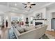 Spacious living room boasts a fireplace, ceiling fan, and a clear view into the dining and sitting areas at 240 Hillsborough Dr., Conway, SC 29526