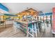 Colorful bar area with wooden accents, pendant lighting, and seating at 2401 S Ocean Blvd. S # 267, Myrtle Beach, SC 29577