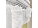 Close-up of the neatly folded and rolled white towels on a towel rack at 2401 S Ocean Blvd. S # 267, Myrtle Beach, SC 29577