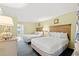 A serene bedroom featuring two comfortable beds with white linens and a partial view of ocean in background at 2401 S Ocean Blvd. S # 267, Myrtle Beach, SC 29577