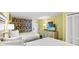 Bedroom with two twin beds, dresser with TV, and tropical-themed curtains at 2401 S Ocean Blvd. S # 267, Myrtle Beach, SC 29577