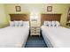 Inviting bedroom featuring two beds with white linens and a central nightstand at 2401 S Ocean Blvd. S # 267, Myrtle Beach, SC 29577