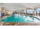 Bright indoor pool area with lounge chairs, tables, and ample natural light at 2401 S Ocean Blvd. S # 267, Myrtle Beach, SC 29577
