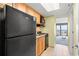 Compact kitchen featuring granite counters and essential appliances next to the ocean-view room at 2401 S Ocean Blvd. S # 267, Myrtle Beach, SC 29577