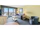 Warm and inviting living room featuring ocean views from the balcony, plush sofa, and stylish decor at 2401 S Ocean Blvd. S # 267, Myrtle Beach, SC 29577