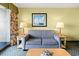 Relaxing living room with cozy seating, accent tables, and a decorative nautical painting at 2401 S Ocean Blvd. S # 267, Myrtle Beach, SC 29577