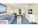 Cozy living room featuring a comfortable sofa, armchair, television and stylish decor at 2401 S Ocean Blvd. S # 267, Myrtle Beach, SC 29577