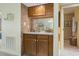 A bar area in the home with tile, wood cabinets, and a mirror backsplash at 250 Maison Dr. # J-11, Myrtle Beach, SC 29572