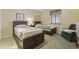 Bedroom with two beds, neutral walls, window with blinds, and patterned bedspreads at 250 Maison Dr. # J-11, Myrtle Beach, SC 29572