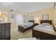 Bedroom with twin beds, neutral walls, and comfortable decor at 250 Maison Dr. # J-11, Myrtle Beach, SC 29572