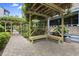 Charming courtyard featuring wooden benches, trellises, and lush greenery at 250 Maison Dr. # J-11, Myrtle Beach, SC 29572