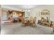 Open dining room with seating for four and adjacent kitchen area at 250 Maison Dr. # J-11, Myrtle Beach, SC 29572