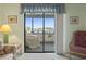 Comfortable living room with a sliding glass door leading to a balcony and view beyond at 250 Maison Dr. # J-11, Myrtle Beach, SC 29572