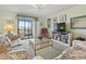 Bright living room featuring sofas, ceiling fan, and balcony access at 250 Maison Dr. # J-11, Myrtle Beach, SC 29572