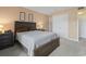 Comfortable primary bedroom with a spacious bed and neutral color palette at 250 Maison Dr. # J-11, Myrtle Beach, SC 29572