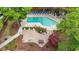 An aerial view of the outdoor pool area, including ample seating, grilling area, and lovely landscaping at 250 Maison Dr. # J-11, Myrtle Beach, SC 29572
