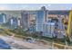Aerial view of condos and beach with pools, palm trees, and ocean views at 2504 N Ocean Blvd. # 934, Myrtle Beach, SC 29577