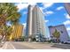 Coastal high-rise condo with ocean view and surrounding palm trees at 2504 N Ocean Blvd. # 934, Myrtle Beach, SC 29577