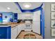 Well-lit kitchen with white appliances, granite countertops, blue accents and decorative anchor accents at 2504 N Ocean Blvd. # 934, Myrtle Beach, SC 29577