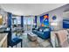 Inviting living room with a coastal decor and ocean views from the balcony, featuring blue accents and comfortable seating at 2504 N Ocean Blvd. # 934, Myrtle Beach, SC 29577