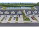 Aerial view of townhomes with a tranquil pond, set amongst lush green trees at 291 Brackish Dr. # 291, Myrtle Beach, SC 29588