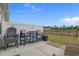 Charming patio features stylish seating and lovely views of the fenced backyard and pond at 291 Brackish Dr. # 291, Myrtle Beach, SC 29588