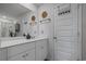 Bathroom vanity area with double sinks, a large mirror, and modern fixtures at 291 Brackish Dr. # 291, Myrtle Beach, SC 29588