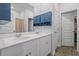 Bright bathroom featuring a dual sink vanity and a linen closet, for ample storage at 291 Brackish Dr. # 291, Myrtle Beach, SC 29588