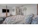 Bedroom showcasing a four poster bed and a door leading to an ensuite bathroom and walk-in closet at 291 Brackish Dr. # 291, Myrtle Beach, SC 29588
