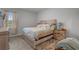 Comfortable bedroom features neutral décor and a large window, providing ample natural light at 291 Brackish Dr. # 291, Myrtle Beach, SC 29588