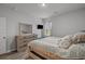 Cozy bedroom featuring a large dresser, mounted television, and ample natural light from the window at 291 Brackish Dr. # 291, Myrtle Beach, SC 29588
