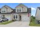 Inviting townhome with a well-manicured lawn and a charming, neutral-toned facade at 291 Brackish Dr. # 291, Myrtle Beach, SC 29588