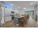 Well-lit kitchen with island, stainless steel appliances, light countertops, and adjacent dining area at 291 Brackish Dr. # 291, Myrtle Beach, SC 29588
