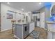Modern kitchen with island, stainless steel appliances, granite countertops, and sliding barn door at 291 Brackish Dr. # 291, Myrtle Beach, SC 29588
