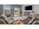 Relaxing living room with a large TV, fireplace, and a view of the outdoors at 291 Brackish Dr. # 291, Myrtle Beach, SC 29588