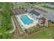 Aerial view of the community pool with lounge chairs, umbrellas, and playground at 291 Brackish Dr. # 291, Myrtle Beach, SC 29588