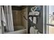 Cozy bathroom featuring a tub, shower, and towel rack with decorative swan towels at 300 N Ocean Blvd. # 1732, North Myrtle Beach, SC 29582