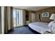 Relaxing bedroom with neutral walls, queen sized bed, and sliding glass door to a balcony at 300 N Ocean Blvd. # 1732, North Myrtle Beach, SC 29582