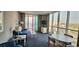 Comfortable living room featuring floor to ceiling windows, television, and stylish furnishings at 300 N Ocean Blvd. # 1732, North Myrtle Beach, SC 29582