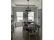 Bright dining room with chandelier, neutral decor, and views of the outdoors at 3019 Visionary Dr., Myrtle Beach, SC 29588