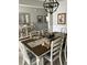 Elegant dining room featuring a chandelier, decorative table setting, and stylish decor at 3019 Visionary Dr., Myrtle Beach, SC 29588