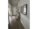 Inviting hallway with decorative wainscoting, stylish console table, and hardwood floors at 3019 Visionary Dr., Myrtle Beach, SC 29588