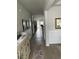 Spacious hallway with wainscoting, hardwood floors, and access to multiple rooms at 3019 Visionary Dr., Myrtle Beach, SC 29588