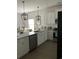 Modern kitchen featuring white cabinets, granite countertops, and stainless steel appliances at 3019 Visionary Dr., Myrtle Beach, SC 29588