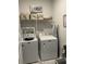 Functional laundry room with modern washer, dryer, shelving, and ample storage space at 3019 Visionary Dr., Myrtle Beach, SC 29588